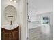 Clean bathroom with a vanity, toilet and view into the living area at 3920 Saltmarsh Loop, Sanford, FL 32773