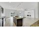 Open concept kitchen with island, granite countertops and stainless steel appliances at 3920 Saltmarsh Loop, Sanford, FL 32773