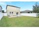 Spacious backyard, grassy lawn and a patio at 3920 Saltmarsh Loop, Sanford, FL 32773