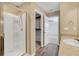 Bathroom with a walk-in shower and access to bedroom and closet at 3920 Saltmarsh Loop, Sanford, FL 32773