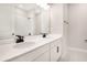 Bathroom with white cabinets, double vanity, and a shower at 4252 Sawtooth Ct, Tavares, FL 32778