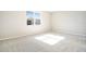 Spacious bedroom with neutral walls and grey carpeting at 4252 Sawtooth Ct, Tavares, FL 32778