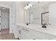 Double vanity bathroom with white cabinets and quartz countertop at 4256 Sawtooth Ct, Tavares, FL 32778
