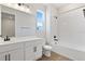 Main bathroom with a bathtub, double vanity, and neutral tile at 4256 Sawtooth Ct, Tavares, FL 32778