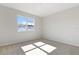 Well-lit bedroom with neutral carpet and large window at 4256 Sawtooth Ct, Tavares, FL 32778