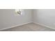 Simple bedroom with neutral colored carpet and walls at 4256 Sawtooth Ct, Tavares, FL 32778