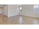 Bright living room with wood-look tile flooring and neutral walls at 4256 Sawtooth Ct, Tavares, FL 32778