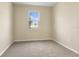 Simple bedroom with carpeted floors and a window at 604 Hennepin Loop, Lake Wales, FL 33898