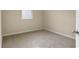 Simple bedroom with carpeted floor and window at 604 Hennepin Loop, Lake Wales, FL 33898