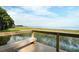 Lakefront view from a wooden deck with bench seating at 4256 Sawtooth Ct, Tavares, FL 32778