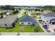 View from above of a home with backyard, white picket fence and covered patio at 2894 Mosshire Cir, Saint Cloud, FL 34772