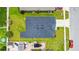 An aerial view of the property and backyard, complete with a covered patio at 2894 Mosshire Cir, Saint Cloud, FL 34772