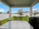 Fenced backyard with a covered patio, patio furniture, and a grill at 2894 Mosshire Cir, Saint Cloud, FL 34772