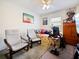 Bedroom furnished with a daybed, two chairs, entertainment center and gaming accessories at 2894 Mosshire Cir, Saint Cloud, FL 34772