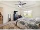 Spacious bedroom with ceiling fan, carpet, and large bed at 2894 Mosshire Cir, Saint Cloud, FL 34772