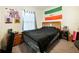 Cozy bedroom with wooden furniture and a window providing natural light at 2894 Mosshire Cir, Saint Cloud, FL 34772