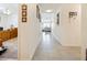 Bright hallway leading to the main living areas, with access to a home office at 2894 Mosshire Cir, Saint Cloud, FL 34772