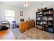 A cozy home office with ample shelving, natural light, and workspace at 2894 Mosshire Cir, Saint Cloud, FL 34772