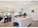 Open concept kitchen and dining area with island seating and a view of the living room at 2894 Mosshire Cir, Saint Cloud, FL 34772