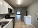 Modern kitchen with stainless steel appliances and white cabinets at 725 Northlake Blvd # 52, Altamonte Springs, FL 32701