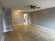 Spacious living room with tile floors, and an open view to the kitchen at 725 Northlake Blvd # 52, Altamonte Springs, FL 32701