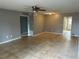 Living room with tile floors, ceiling fan, and neutral gray walls at 725 Northlake Blvd # 52, Altamonte Springs, FL 32701