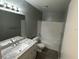 Bathroom with granite countertop, white cabinets and a bathtub at 725 Northlake Blvd # 52, Altamonte Springs, FL 32701