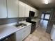 Clean kitchen featuring white cabinets and new countertops at 725 Northlake Blvd # 52, Altamonte Springs, FL 32701