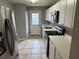 Modern kitchen with white cabinets and stainless steel appliances at 725 Northlake Blvd # 52, Altamonte Springs, FL 32701