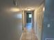 Clean hallway with tile flooring and access to rooms at 725 Northlake Blvd # 52, Altamonte Springs, FL 32701