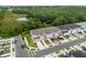 Aerial view of townhouses with garages and lush landscaping at 4801 Sparkling Shell Ave, Kissimmee, FL 34746