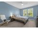 Bright bedroom with double bed and plenty of natural light at 4801 Sparkling Shell Ave, Kissimmee, FL 34746
