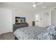 Spacious bedroom with a large TV and ample closet space at 4801 Sparkling Shell Ave, Kissimmee, FL 34746