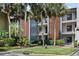 Two-story building with landscaping and fire hydrant at 15 Escondido Cir # 141, Altamonte Springs, FL 32701