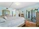 Main bedroom with wood floors and access to a balcony at 15 Escondido Cir # 141, Altamonte Springs, FL 32701