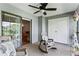 Screened lanai with rocking chairs and access to living room at 15 Escondido Cir # 141, Altamonte Springs, FL 32701