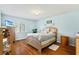 Main bedroom with wood floors and walkout balcony at 15 Escondido Cir # 141, Altamonte Springs, FL 32701
