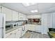 Galley-style kitchen with granite countertops and ample storage at 15 Escondido Cir # 141, Altamonte Springs, FL 32701