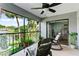 Screened lanai overlooking a lake with rocking chairs at 15 Escondido Cir # 141, Altamonte Springs, FL 32701