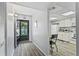 Inviting entryway with wood-look floors and view into the kitchen at 15 Escondido Cir # 141, Altamonte Springs, FL 32701