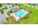 Resort-style community pool with plenty of lounge chairs at 12151 Alder Branch Loop, Orlando, FL 32824