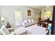 Living room features a sofa, chairs, and dining table at 6335 Contessa Dr # 205, Orlando, FL 32829