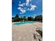 Community pool with lounge chairs and patio area at 6335 Contessa Dr # 205, Orlando, FL 32829