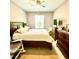 Bright bedroom with a double bed, dresser, and window at 6335 Contessa Dr # 205, Orlando, FL 32829