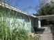 Side view of a light blue house with carport at 1632 N Fullers Cross Rd, Winter Garden, FL 34787
