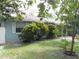 Front view of a light blue house with mature landscaping at 1632 N Fullers Cross Rd, Winter Garden, FL 34787
