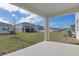 Covered patio overlooks a spacious backyard at 4236 Sawtooth Ct, Tavares, FL 32778