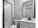 Bathroom with white vanity, black fixtures, and a frameless glass shower at 4236 Sawtooth Ct, Tavares, FL 32778