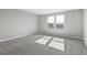 Bright bedroom featuring neutral walls and carpet at 4236 Sawtooth Ct, Tavares, FL 32778