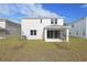 Two-story house with backyard patio and landscaping at 4236 Sawtooth Ct, Tavares, FL 32778